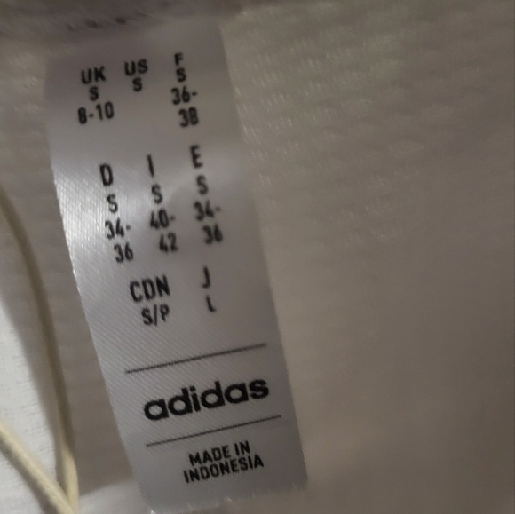 NWT Adidas golf or tennis skort. Front pockets.  White.  Orange logo. Size Small - Picture 7 of 7